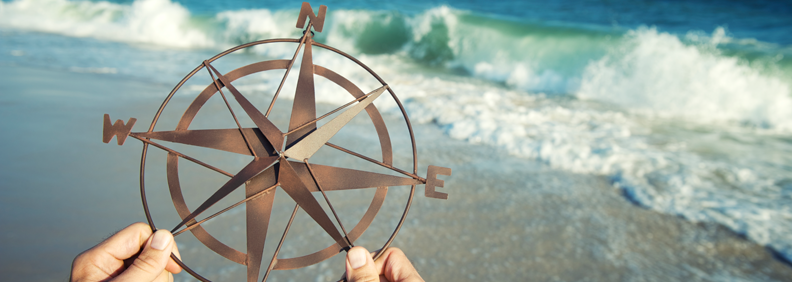 Compass by the sea
