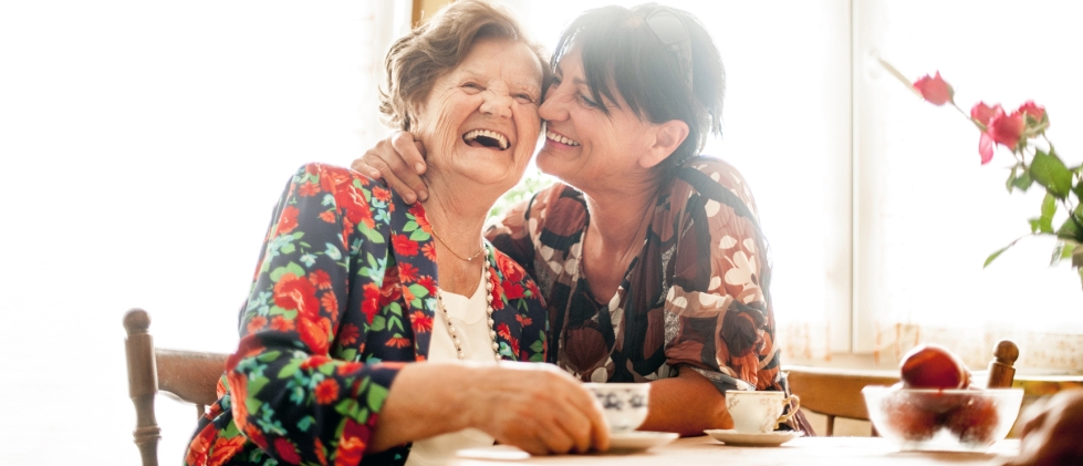 Senior mother with daughter smiling and laughing together