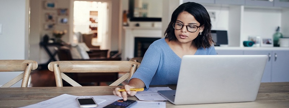 Women at desk in Jacksonville going over student loans