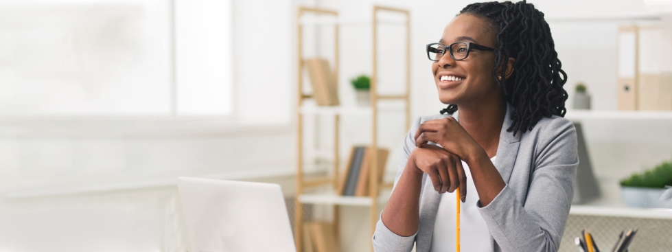 Women smiling and sitting at desk in Jacksonville