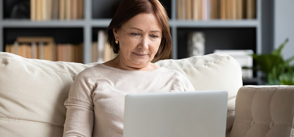 Senior women looking at her laptop