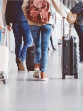 People walking with suitcases