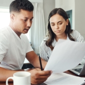 A couple looking over paperwork together