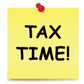 Tax Time written on sticky note- Federal Income Tax Returns Due For Most Individuals