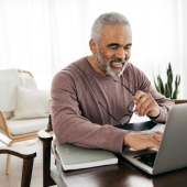 Man sitting at desk in Jacksonville Florida while funding an IRA